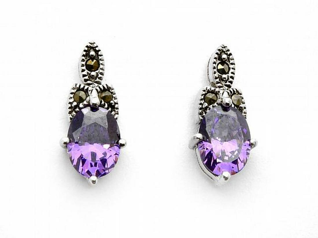Sterling Silver Oval Amethyst & Marcasite Earrings: • Genuine marcasite •Amethyst cubic zirconia • Butterfly backings for comfortable fit • Fine Sterling Silver
