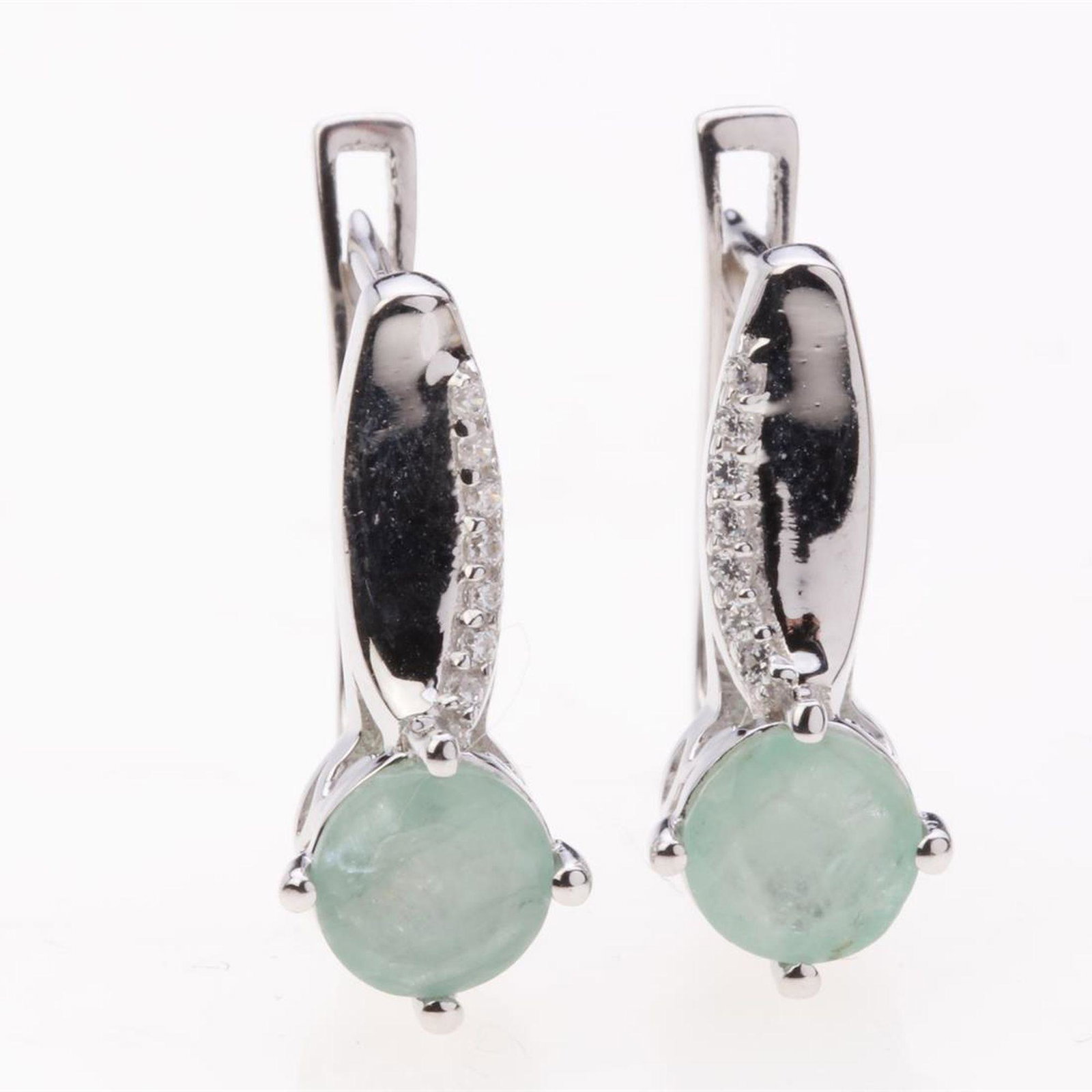 Emerald & Zircon Sterling Silver Earrings: Emerald & Zircon Sterling Silver Earrings .Metal: Sterling Silver .Stone: 6 Mm Rd Emarald &White Zircon .Dimension: 18.8X7.8 Mm .Total Weight: 3.92 Grams .Finish: Rhodium .Backing: French Clip