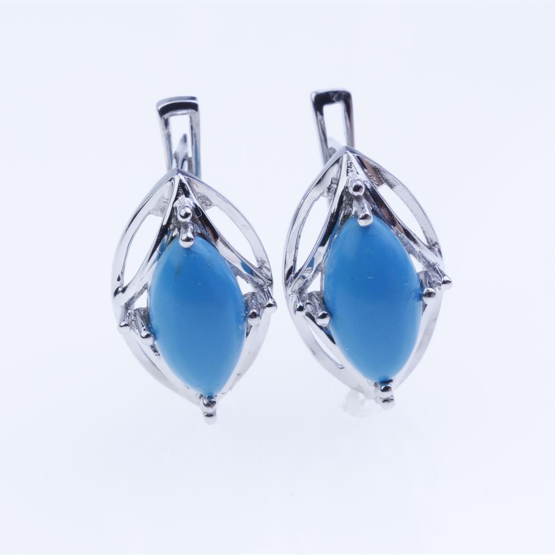 Sterling Silver Syn Blue Turquoise Earrings: Sterling Silver Syn Blue Turquoise Earrings • Metal: Sterling Silver • Stone: 12X6Mm Mq Synthetic Blue Turquoise • Dimension: 17.8X10.5 Mm • Total Weight: 4.37 Grams • Fi