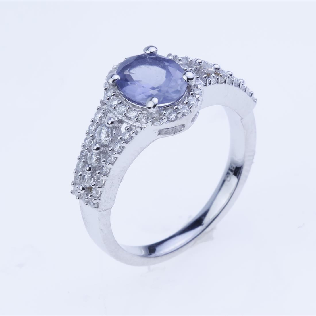 Size 7.5 Sterling Silver Iolite & Zircon Ring: Size 7.5 Sterling Silver Iolite & Zircon Ring • Metal: Sterling Silver • Stone: 8X6Mm Oval Shape Iolite, Zircon • Width : 10.58 Mm • Appx Weight: 3.64 Grams • Finish: Rho