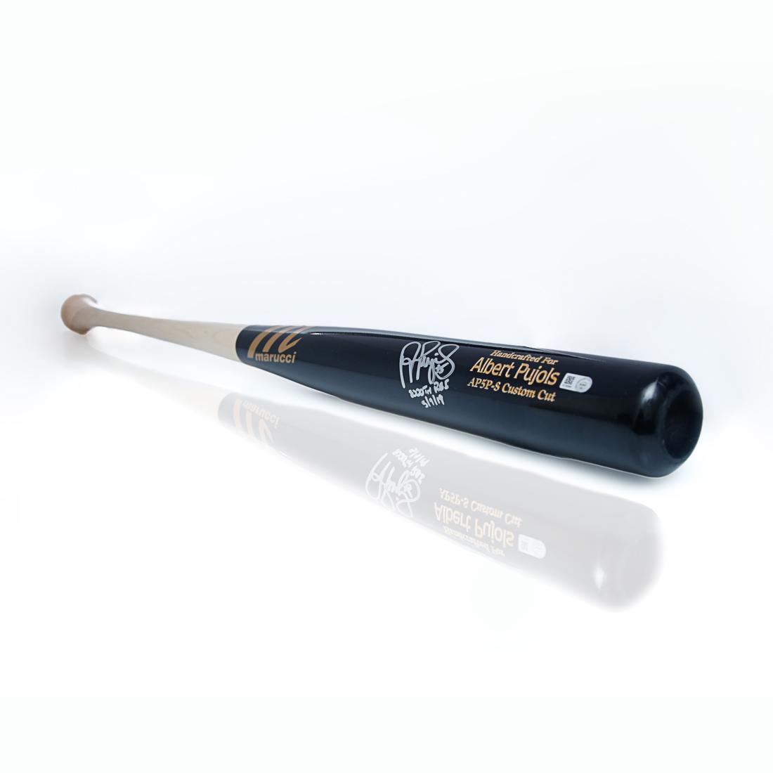Albert Pujols Signed 2000 RBI Baseball Bat: "Albert Pujols Autographed Baseball Bat with Special Inscription '2000th RBI 5/9/19' - Commemorating A Historic Milestone" Calling all baseball enthusiasts and collectors! Up for auction is a one-of-a