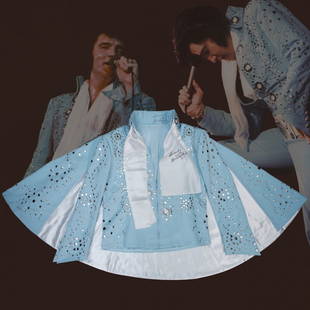 Elvis Presley Signed Stage Jacket & Scarf: Welcome to our extraordinary auction featuring an iconic piece of music history - the Elvis Presley Signed Light Blue Stage Cape Jacket and Signed White Scarf. This remarkable item holds immense