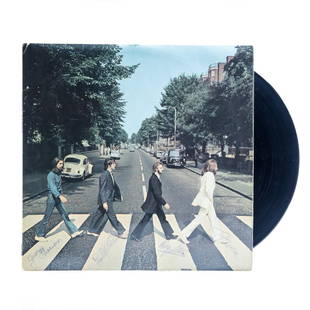 Beatles Band Signed Abbey Road Album: Up for auction is an extraordinary piece of music history - a Beatles Band Signed Abbey Road Album. This iconic album, which features the Fab Four walking across the famed Abbey Road zebra crossing,