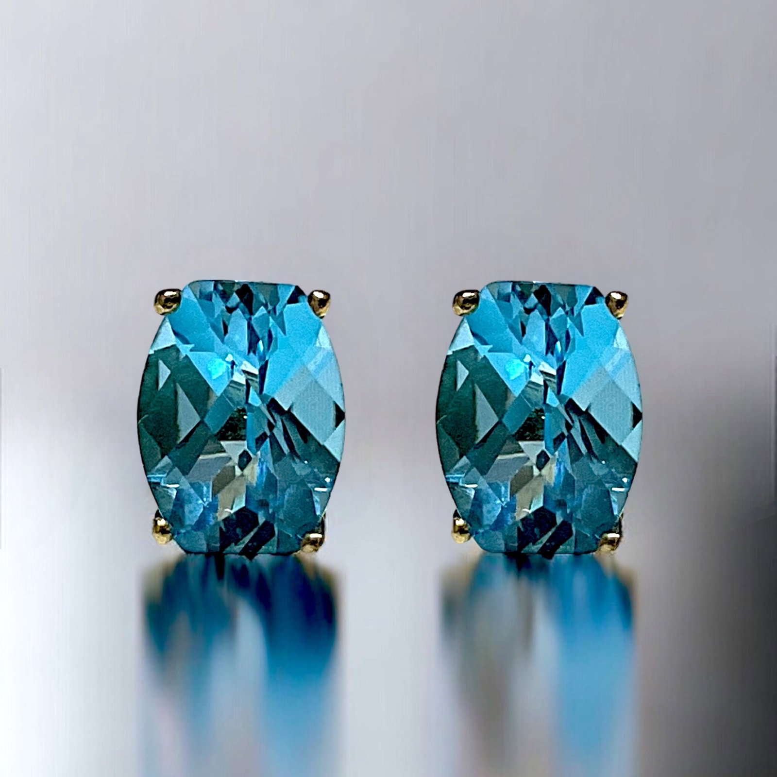 10K Gold Fancy Cut Blue Topaz Stud Earrings: Elevate your look with these stunning 10K Gold Fancy Cut Blue Topaz Stud Earrings. The intricate, fancy-cut blue topaz gems capture and reflect light, creating a mesmerizing sparkle. Set in warm, lust