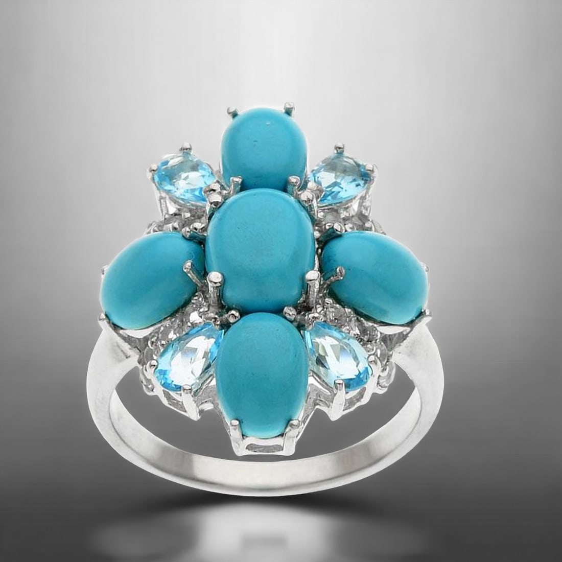 Sterling Silver Sonora Turquoise & Multi-Topaz: Adorn your finger with the captivating beauty of our Sterling Silver Ring featuring Sonora Turquoise, Swiss Blue Topaz, and White Topaz, perfectly sized for a comfortable fit at Size 7. This exquisite
