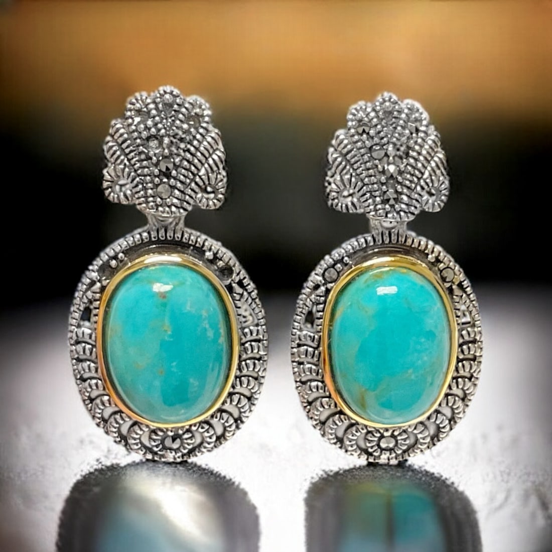 14K & Sterling Silver Marcasite & Turquoise Earrings: Adorn your ears with the captivating blend of tradition and sophistication with our 14K & Sterling Silver Marcasite & Turquoise Earrings. The rich turquoise stones, set in a combination of 14K gold an