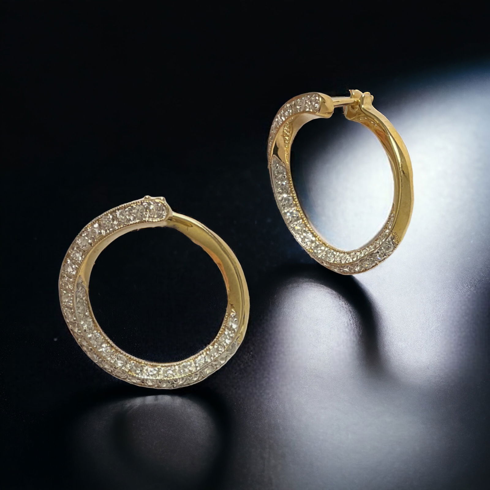 14K Gold Earrings with a stunning array of sparkling accents: Product Details Item: Earrings Metal: 14K Gold Gemstone: CZ Approximate Measurements: Width 20 mm Ring Size: Not Applicable Chain Length: Not Applicable Chain Metal: Not Applicable