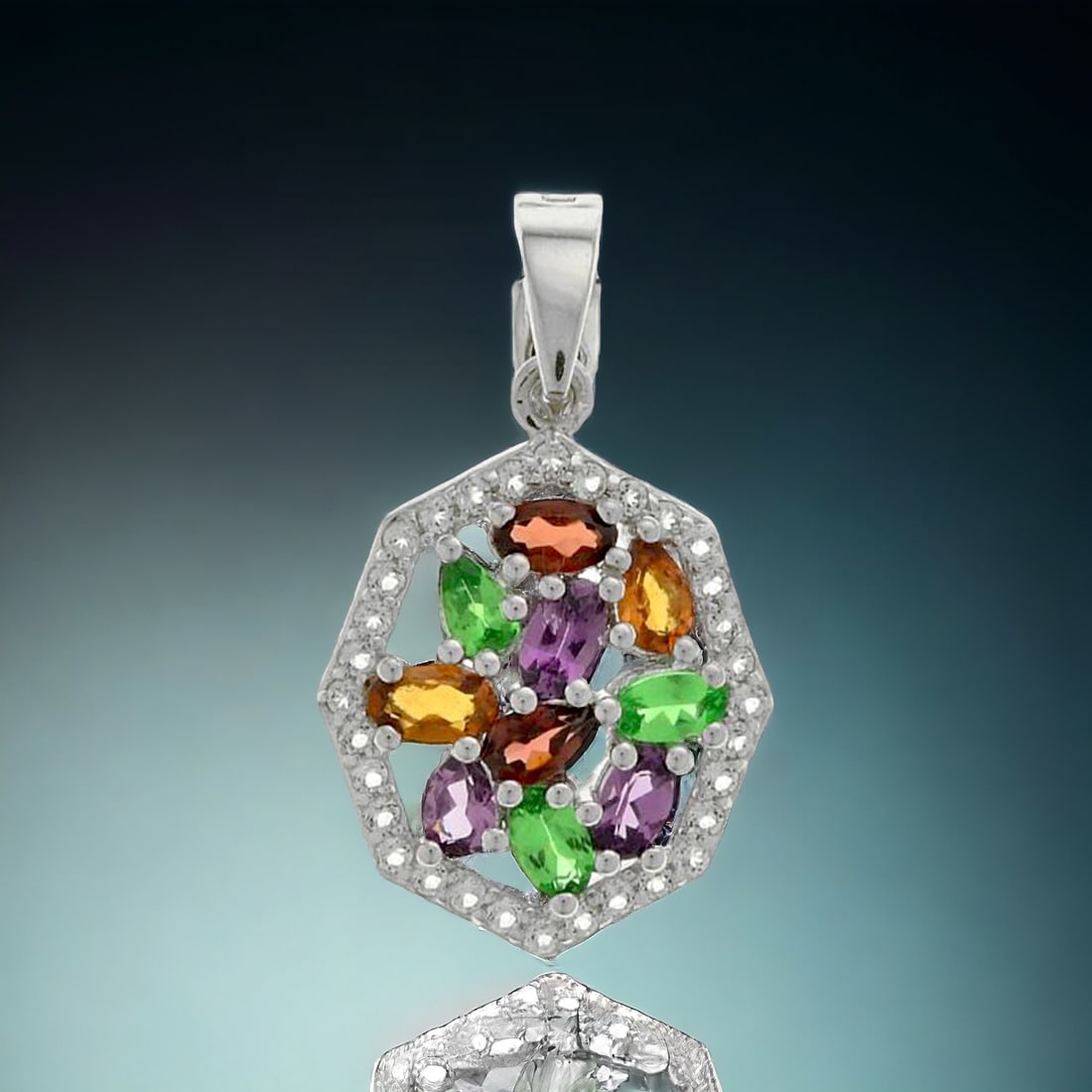 Exotic Mulit-Garnet Sterling Silver Pendant surrounded by glimmering White Topaz: Product Details Item: Pendant Metal: Sterling Silver Gemstone: Purple Garnet, Mozambique Garnet, Hessonite Garnet, & White Topaz Approximate Measurements: 32.2 mm X 18.3mm Ring Size: Not Applicable