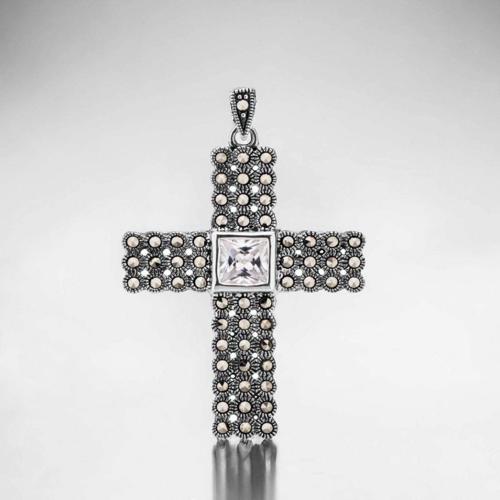 Marcasite Cross Pendant in Sterling Silver: Product Details Item: Pendant Metal: Sterling Silver Gemstone: Marcasite & CZ Approximate Measurements: 44.8 mm X 29.6 mm Ring Size: Not Applicable Chain Length: Not Applicable Chain Met