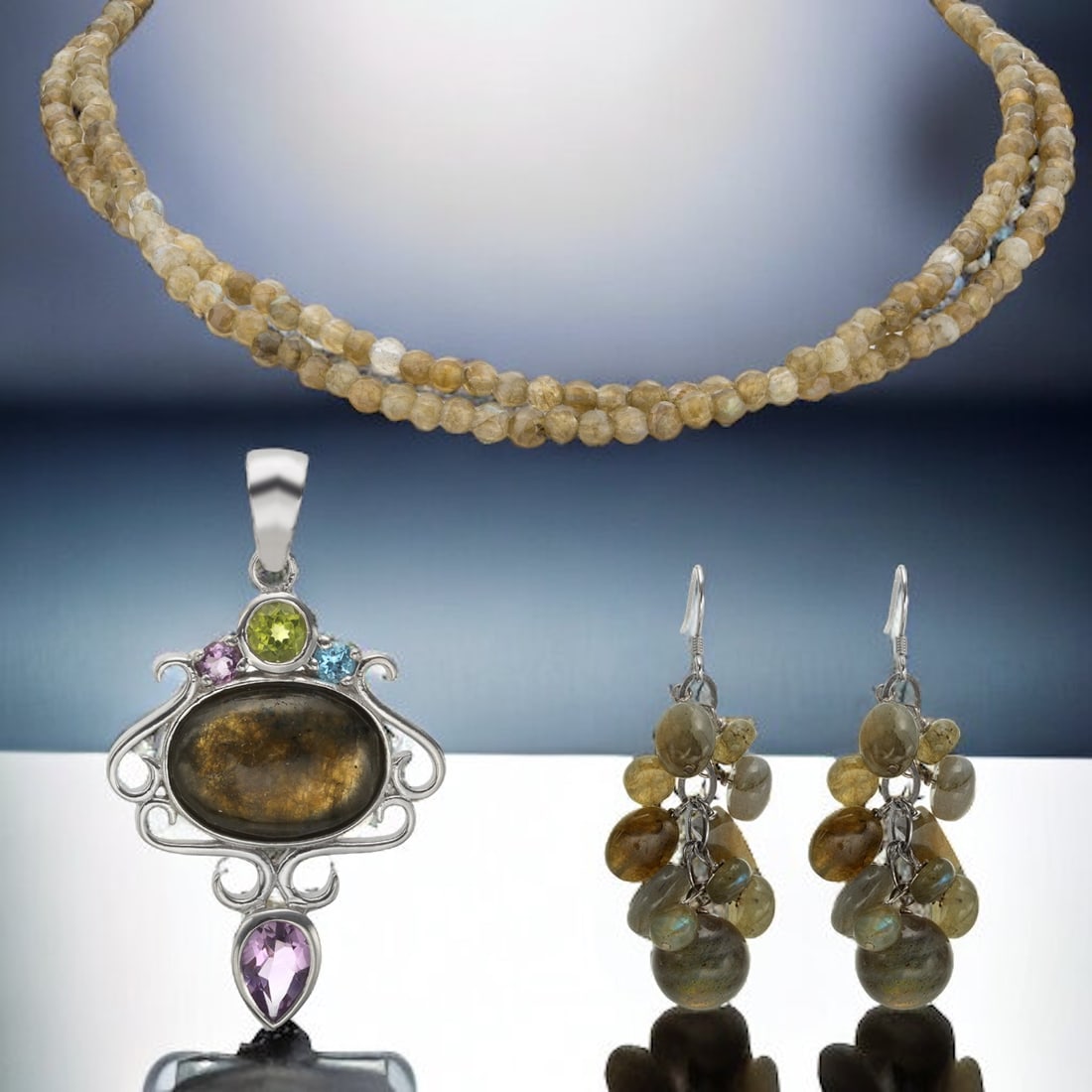 Radiant Labradorite and Gemstone Ensemble: This exquisite collection features a 17" double strand necklace adorned with captivating labradorite stones, their iridescent hues shimmering with every movement. Complementing the necklace are sterli