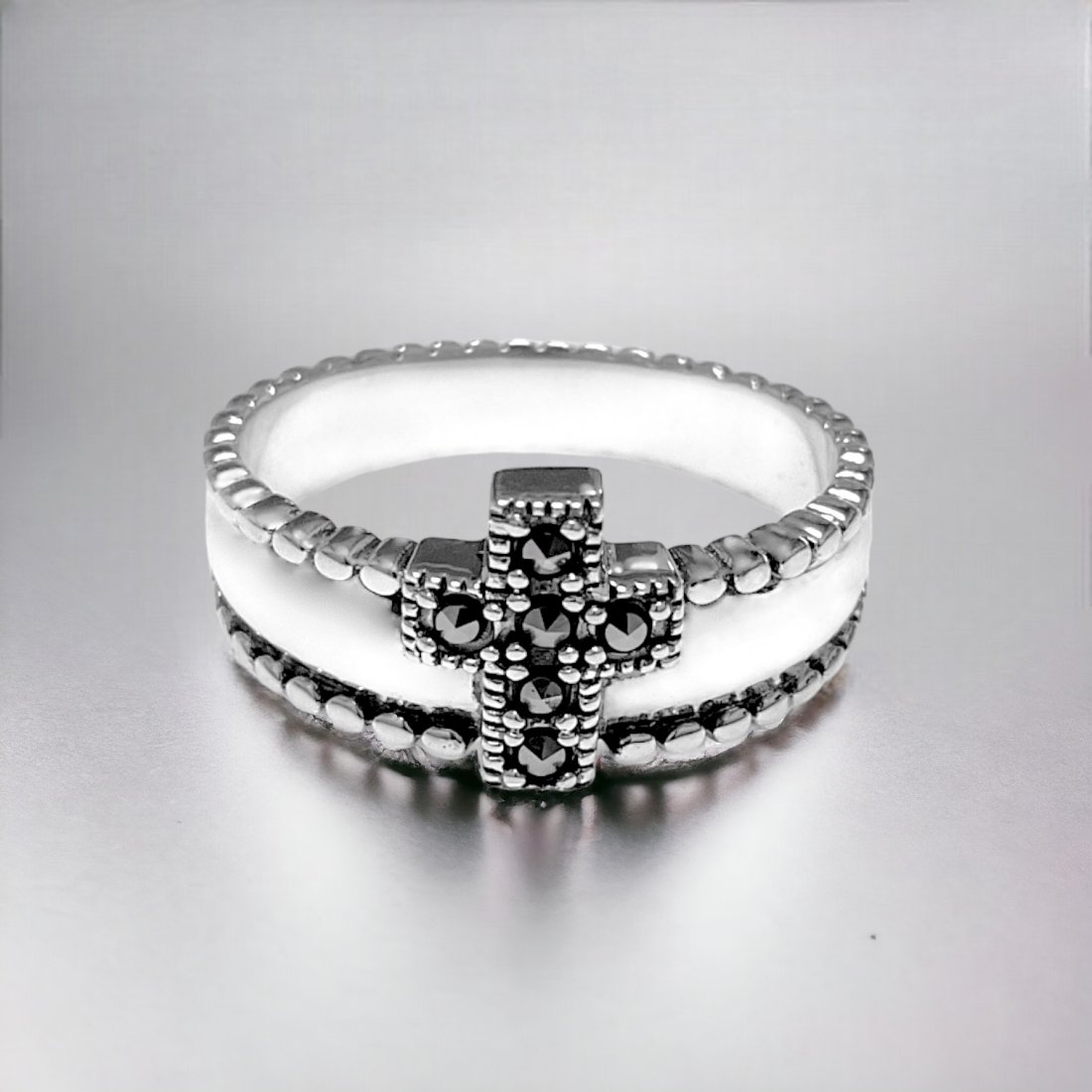 Marcasite Cross Sterling Silver Ring Size 10: Product Details Item: Ring Metal: Sterling Silver Gemstone: Marcasite Approximate Measurements: Width: 9.8 mm Ring Size: Size 10 Chain Length: Not Applicable Chain Metal: Not Applicable<