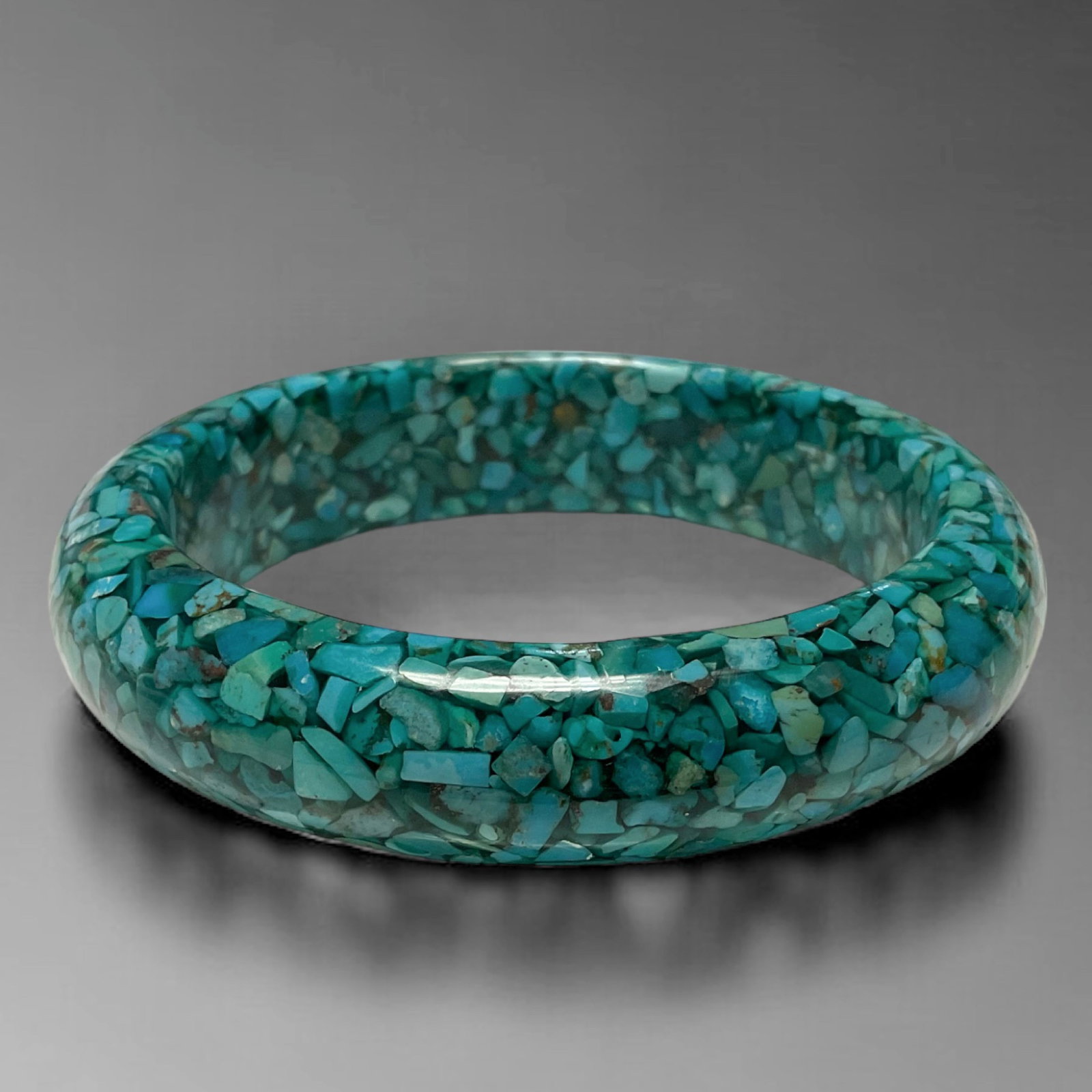 8 inch Turquoise Resin Texture Slip On Bangle: Product Details Item: Bangle Bracelet Metal: Not Applicable Gemstone: Turquoise Resin Approximate Measurements: Width: 18.2 mm Ring Size: Not Applicable Chain Length: Not Applicable