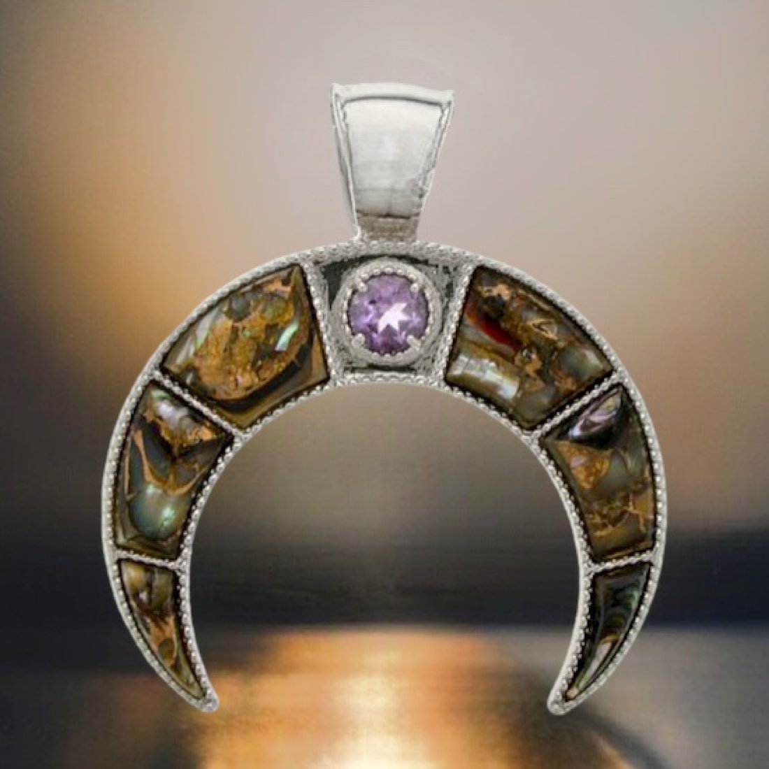 Double Horn Bronze Abalone & Amethyst Pendant: Product Details Item: Pendant Metal: Sterling Silver Gemstone: Bronze Abalone & Amethyst Approximate Measurements: 50 mm X 45 mm Ring Size: Not Applicable Chain Length: Not Applicable