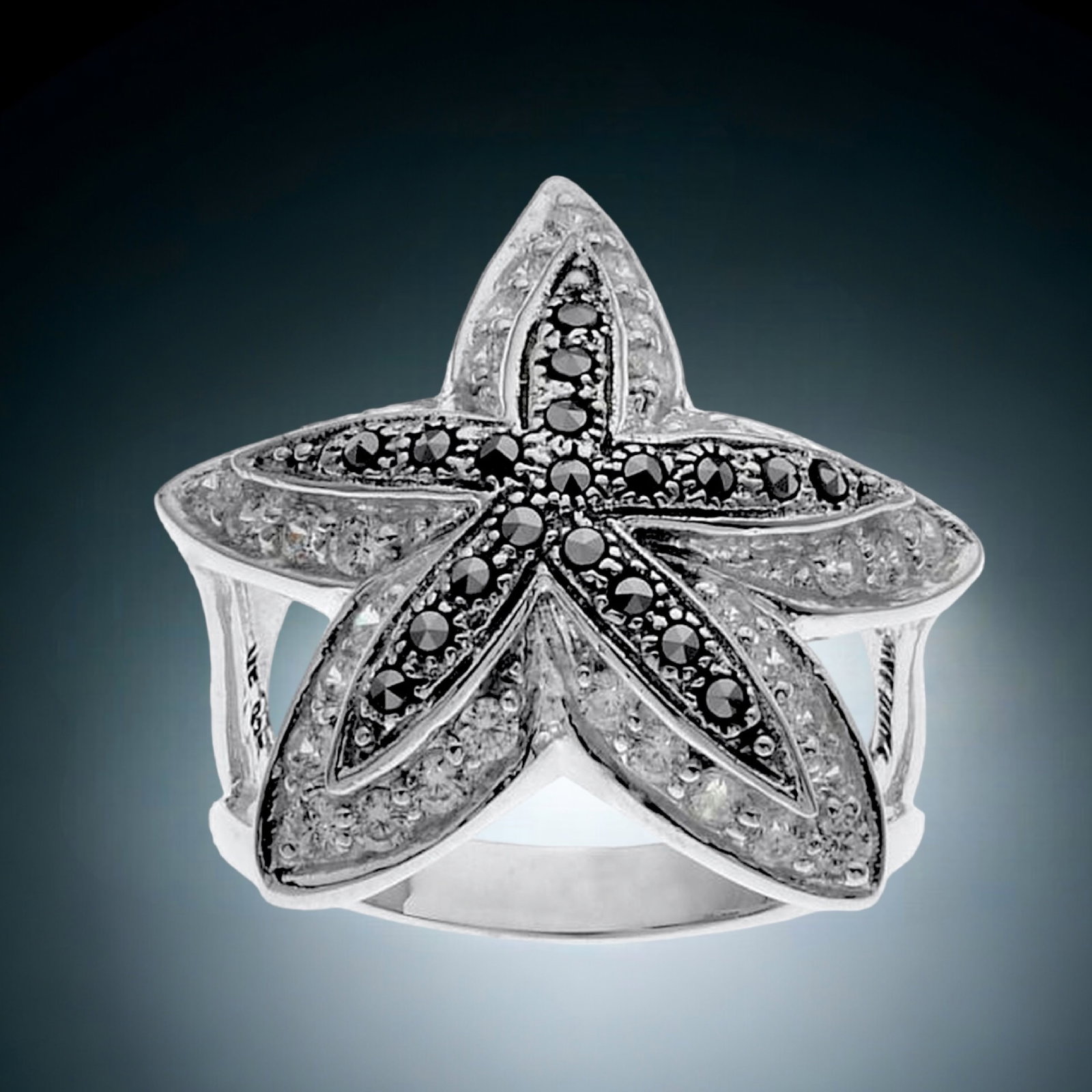 Oceanic Starfish Sterling Silver Ring with Marcasite & Simulated Diamond: Product Details Item: Ring Metal: Sterling Silver Gemstone: Marcasite & CZ Approximate Measurements: Width: 22.7 mm Ring Size: Size 6 Chain Length: Not Applicable Chain Metal: Not App