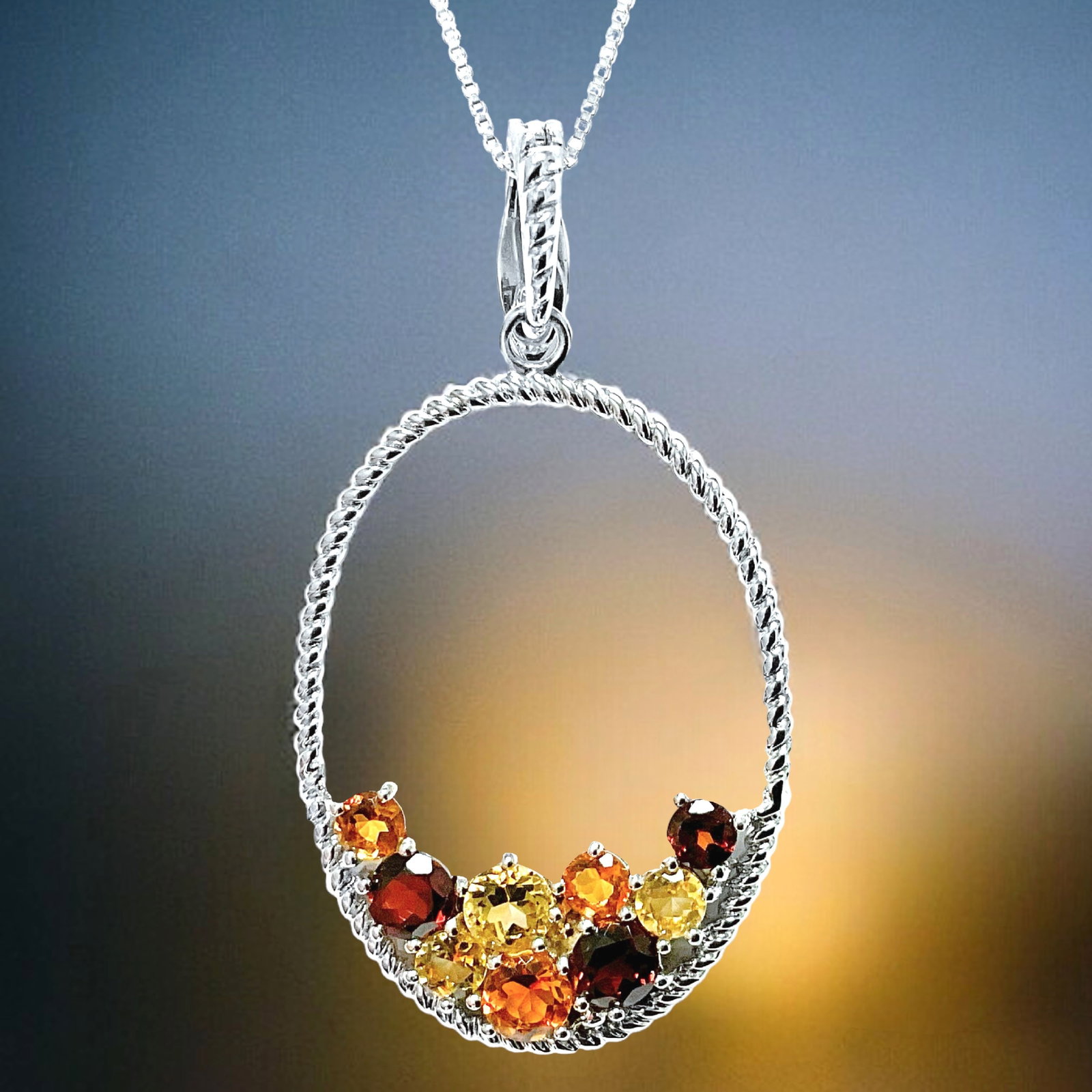 Bespoken Citrine & Garnet Pendant set in Sterling Silver: Product Details Item: Pendant Metal: Sterling Silver Gemstone: Citrine & Garnet Approximate Measurements: 53.2 mm X 28.5 mm Ring Size: Not Applicable Chain Length: Not Applicable Cha