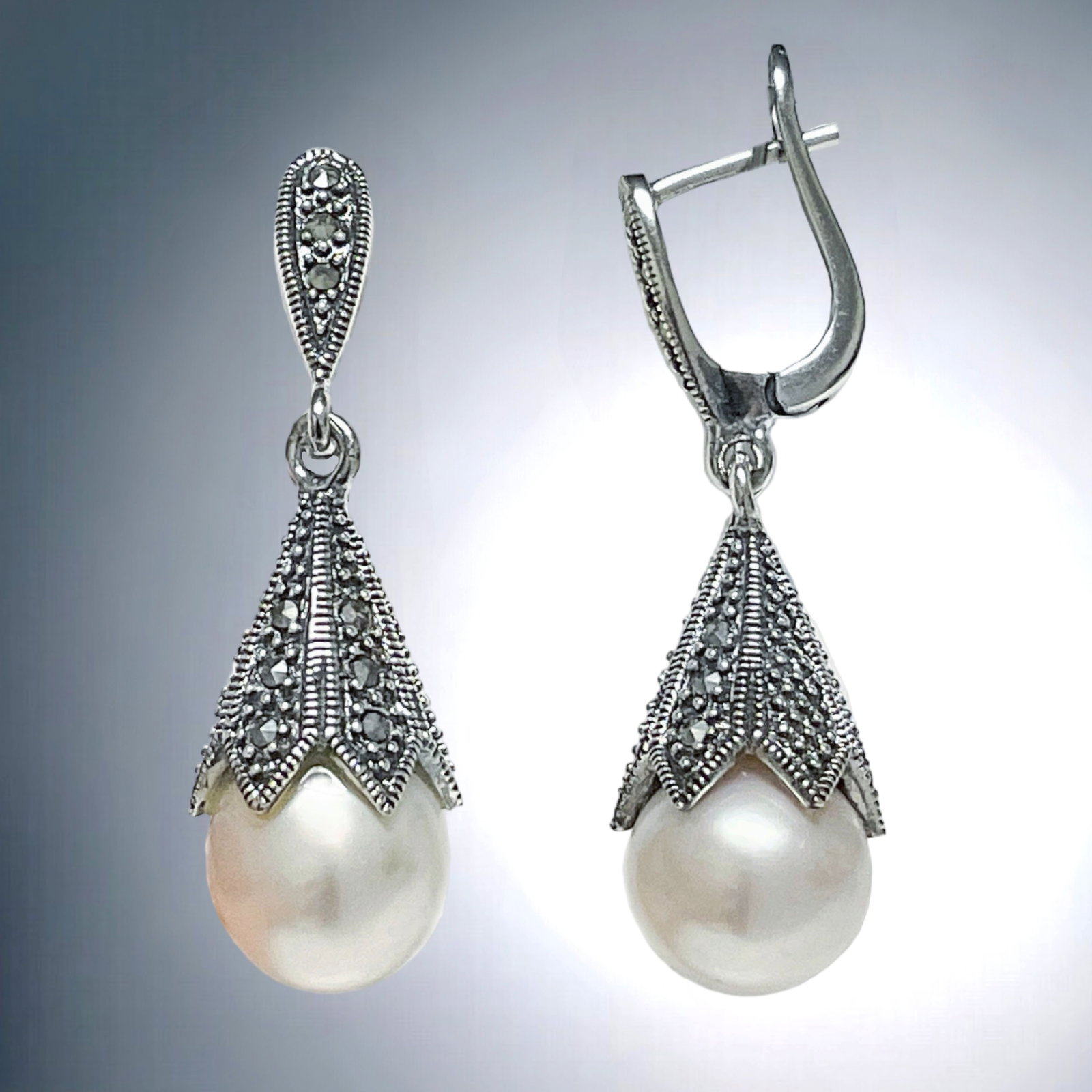 Vintage-inspired Pearl & Marcasite Sterling Silver Earrings: Product Details Item: Earrings Metal: Sterling Silver Gemstone: Pearl & Marcasite Approximate Measurements: 39.2 mm X 12.4 mm Ring Size: Not Applicable Chain Length: Not Applicable Ch