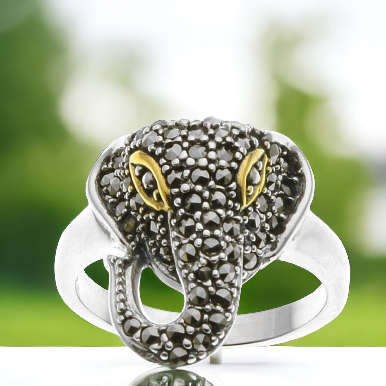 Elephant Sterling Silver Ring with enchanting Marcasite - Size 9: Lovely 14k gold plating provides a lustrous accent Product Details Item: Ring Metal: Sterling Silver Gemstone: Marcasite Approximate Measurements: Width: 17.7 mm Ring Size: Size 9 Chain Lengt
