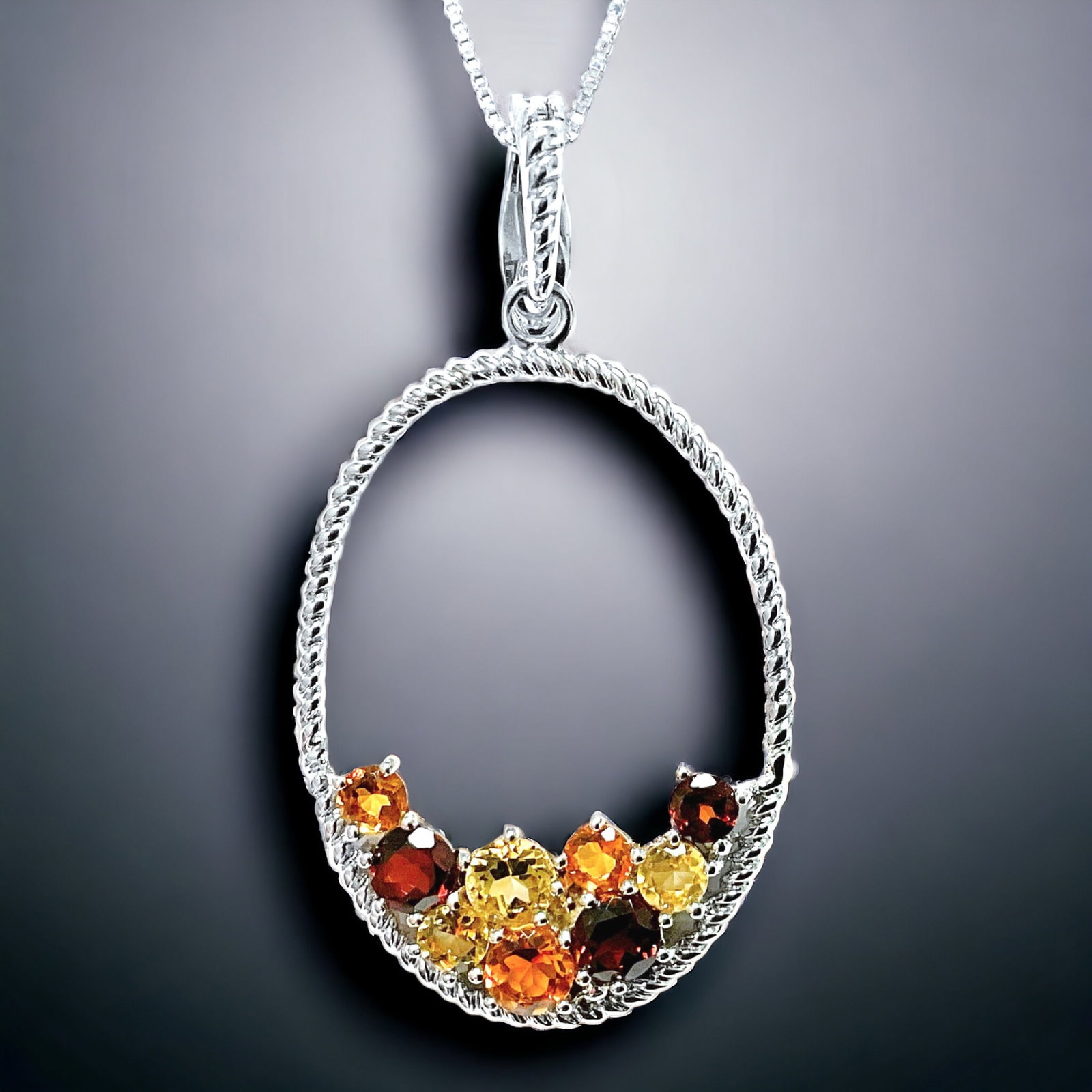 Spectacular Citrine & Garnet Sterling Silver Pendant with 18" chain: Product Details Item: Pendant Metal: Sterling Silver Gemstone: Citrine & Garnet Approximate Measurements: 52.7 mm X 28.57mm Ring Size: Not Applicable Chain Length: 18" Chain Metal: Sterl