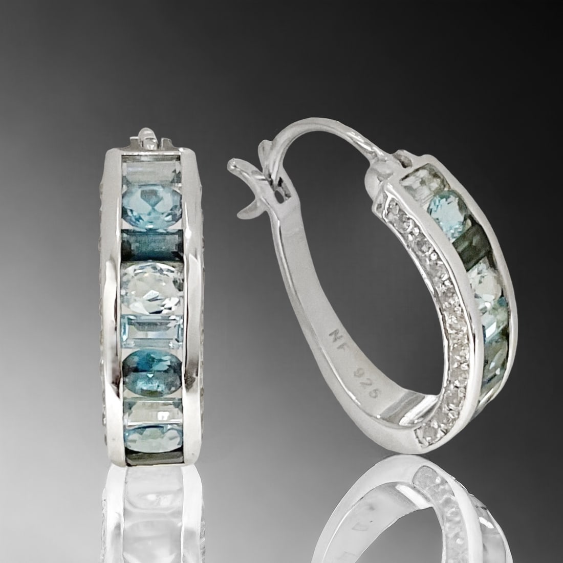 Enjoy this stunning array of Blue & White Topaz set in Sterling Silver Hoop Earrings (1 of 1)