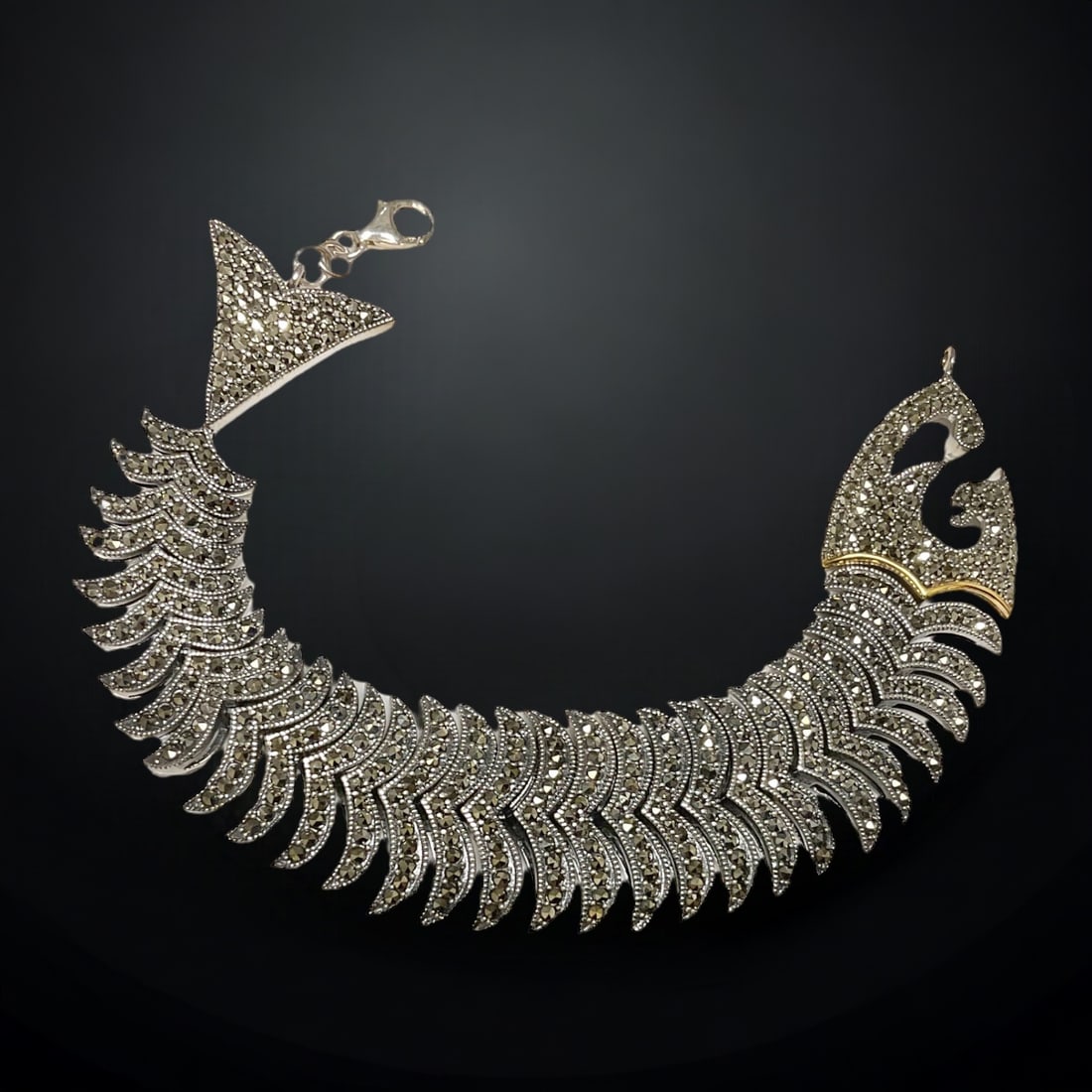 14K Gold & Sterling Silver expertly crafted Marcasite 7.5" Bracelet: Product Details Item: Bracelet Metal: 14K Gold & Sterling Silver Gemstone: Marcasite Approximate Measurements: 7.5" X 23.8 mm Ring Size: Not Applicable Chain Length: Not Applicable Chain