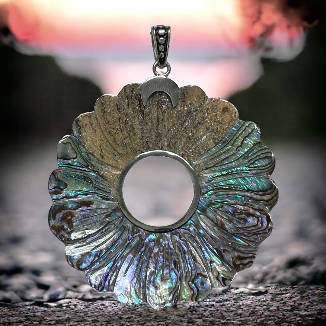Radiant Abalone Sterling Silver Pendant with an array of colors to match a Sunset: Product Details Item: Pendant Metal: Sterling Silver Gemstone: Abalone Approximate Measurements: Not Applicable Ring Size: Not Applicable Chain Length: Not Applicable Chain Metal: Not