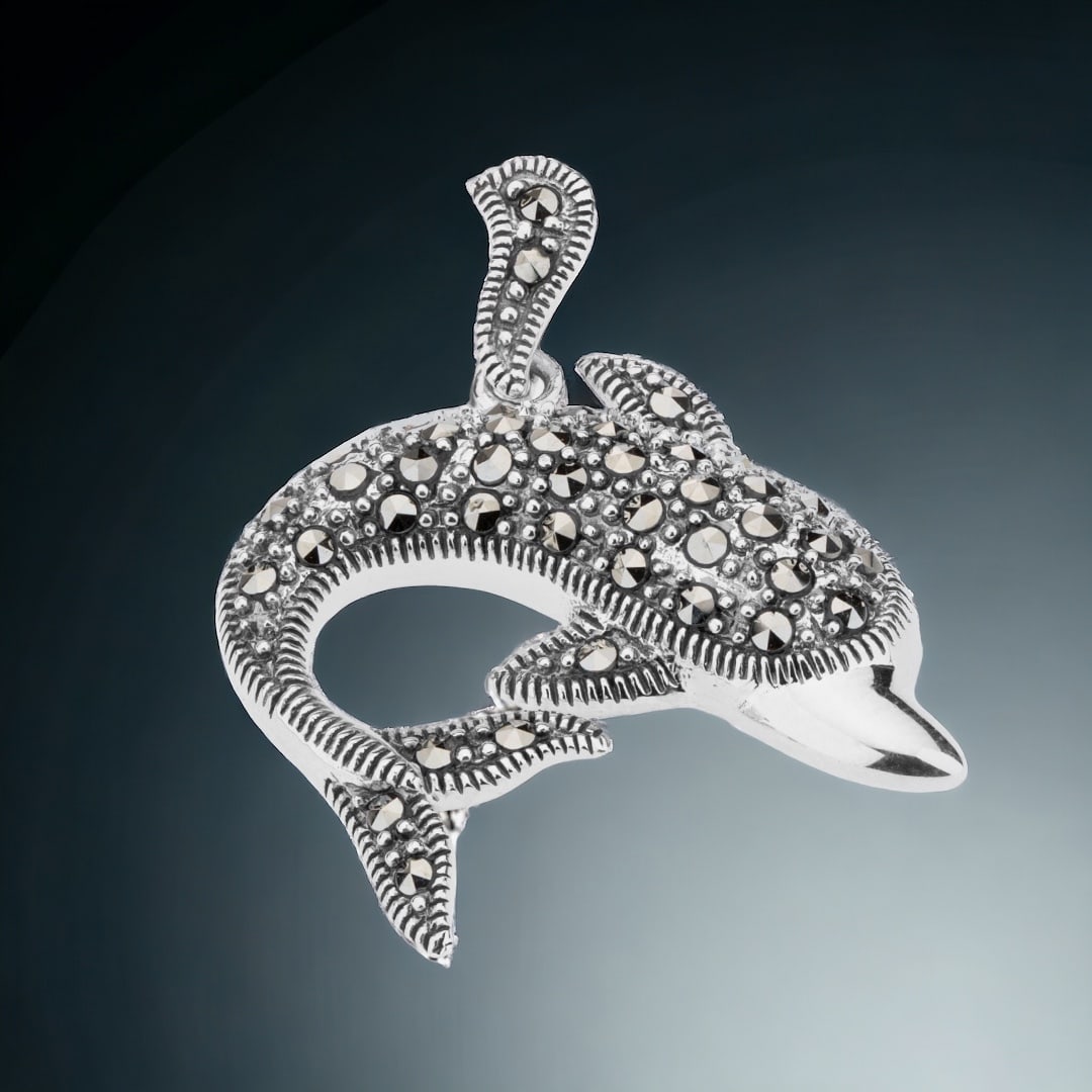 Dazzling Marcasite Dolphin Pendant set in Sterling Silver: Product Details Item: Pendant Metal: Sterling Silver Gemstone: Marcasite Approximate Measurements: 33.5 mm X 30.1 mm Ring Size: Not Applicable Chain Length: Not Applicable Chain Meta