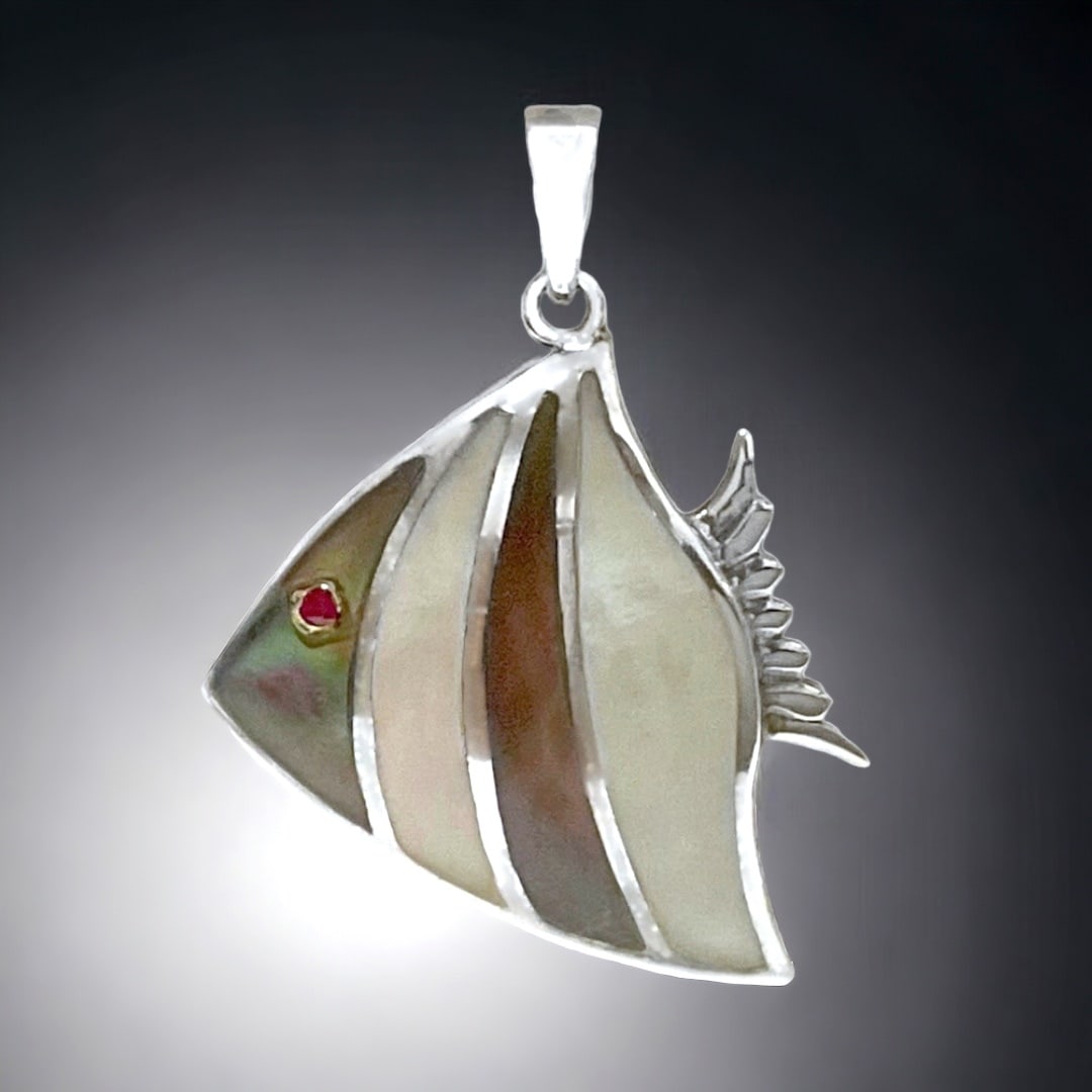 Whimisical Grey & White Mother-of-Pearl Pendant set in Sterling Silver: Product Details Item: Pendant Metal: Sterling Silver Gemstone: Grey & White Mother-of-Pearl Approximate Measurements: 35.9 mm X 24.4 mm Ring Size: Not Applicable Chain Length: Not Applicable