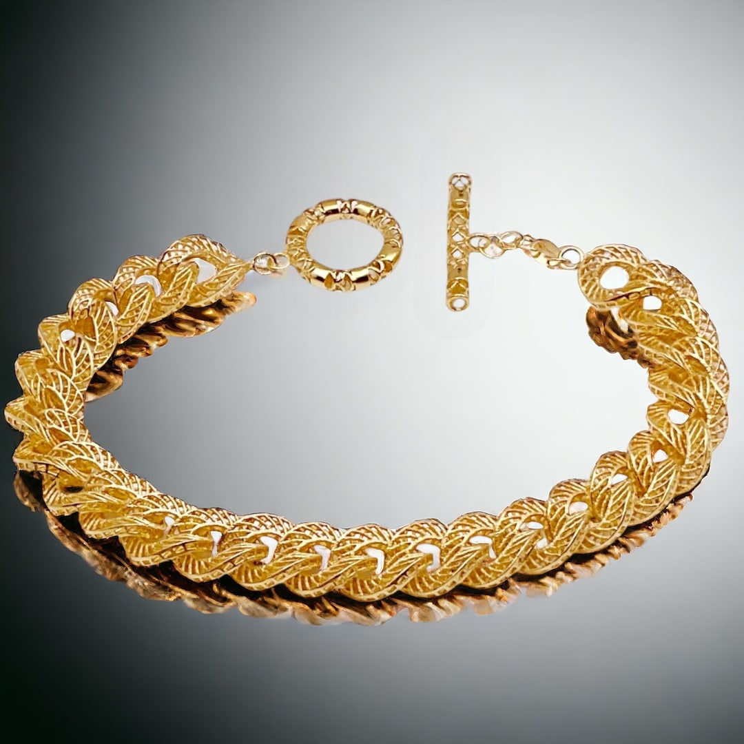 Golden Elegance Enchanting Vermeil 8.5" Bracelet: Product Details Item: Bracelet Metal: Vermeil Gemstone: None Approximate Measurements: Width: 10.6 mm Ring Size: Not Applicable Chain Length: Not Applicable Chain Metal: Not Applicable