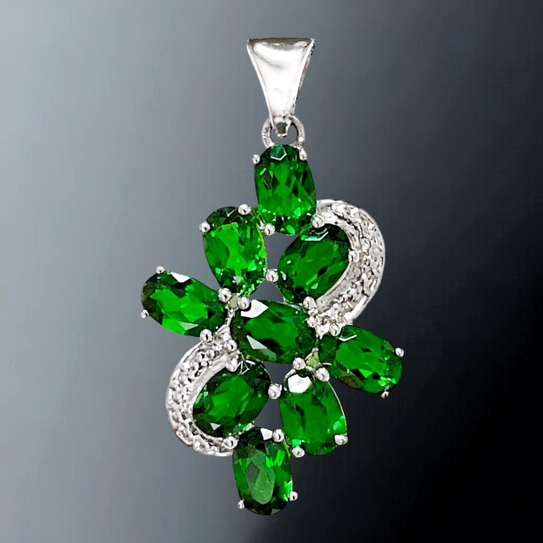 Dazzling Chrome Diopside Sterling Silver Pendant with 9 gemstones: Product Details Item: Pendant Metal: Sterling Silver Gemstone: Chrome Diopside Approximate Measurements: 32.9 mm X 17.5 mm Ring Size: Not Applicable Chain Length: Not Applicable Chain