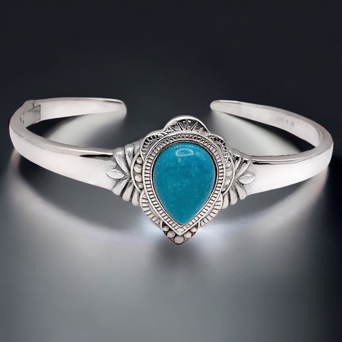 Elegant Pear Shaped Turquoise set on a Sterling Silver Bangle Bracelet (1 of 2)