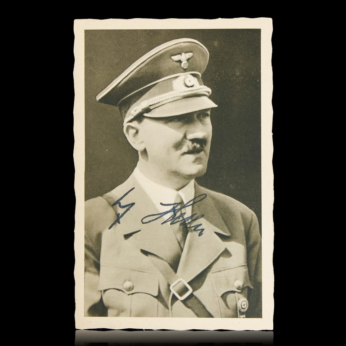 Adolf Hitler Signed Postcard, Dated "3.10.1938": A Chilling Artifact of History - Adolf Hitler Signed Postcard, Dated "3.10.1938"The auction presents a deeply historical and profoundly somber piece – a black and white photograph of Adolf Hitler, a