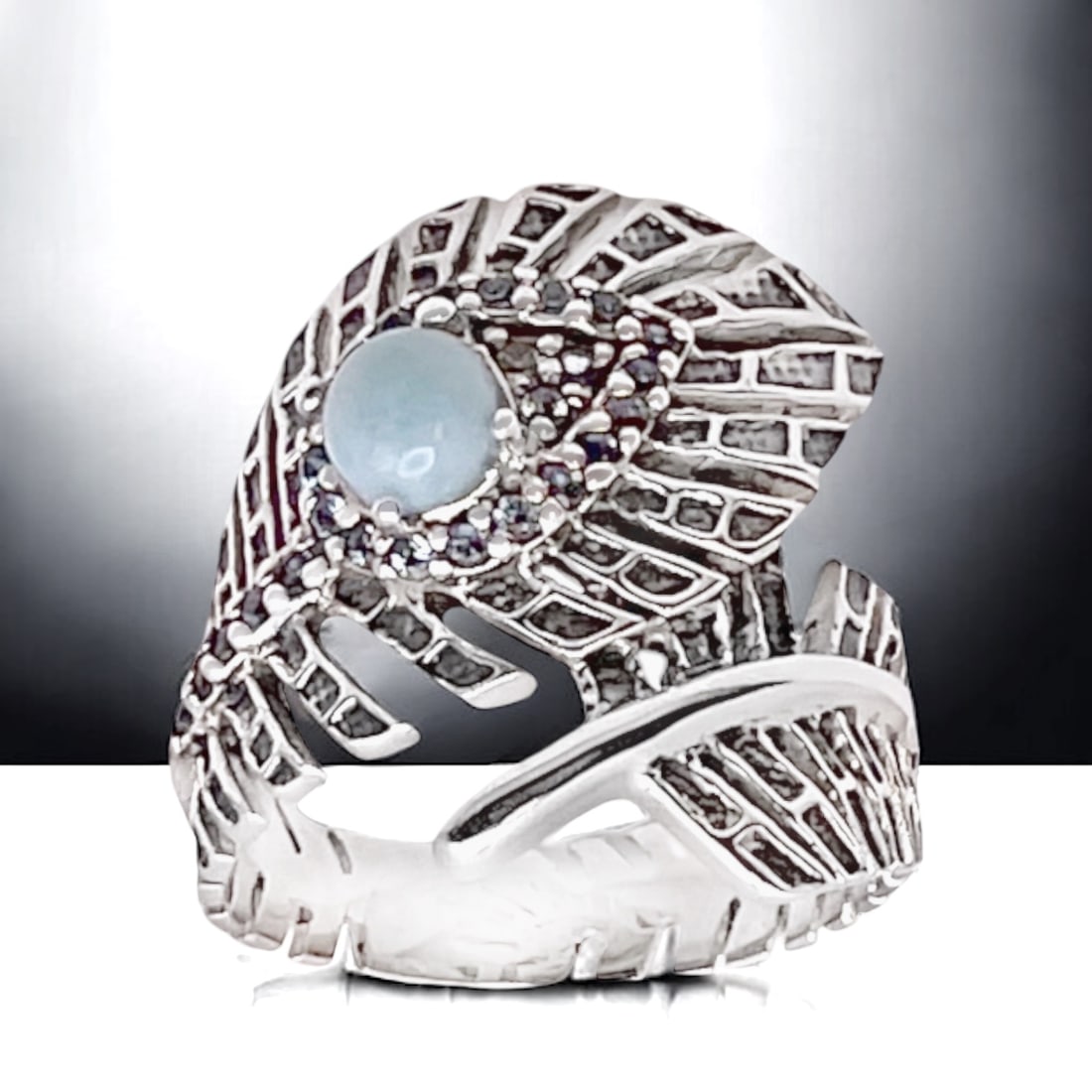 Faboulous Larimar Feather style Sterling Silver Ring with Blue Topaz - Size 8: Product Details Item: Ring Metal: Sterling Silver Gemstone: Larimar & Blue Topaz Approximate Measurements: Width: 22.2 mm Ring Size: 8 Chain Length: Not Applicable Chain Metal: Not Appl