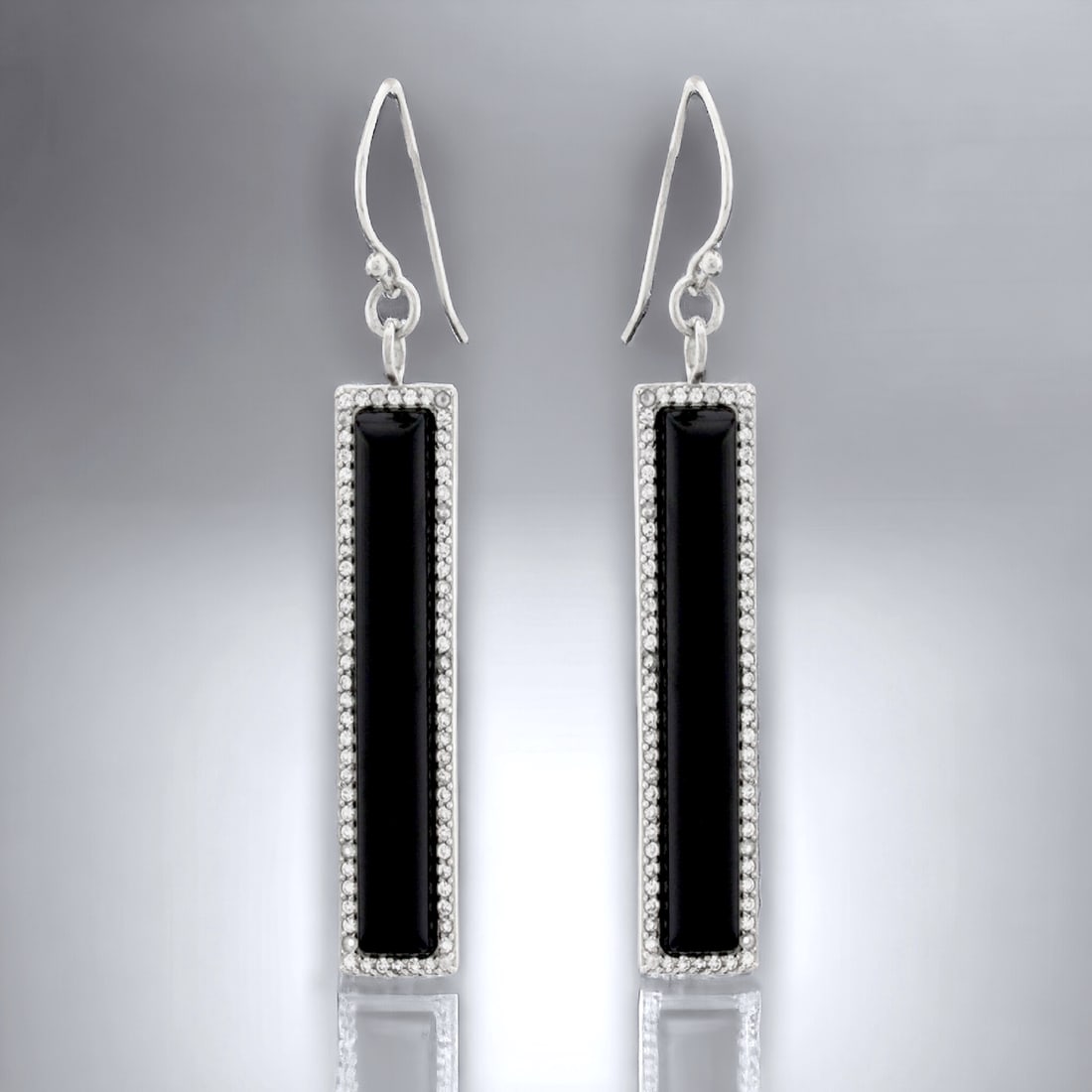 Elongated Rectangle Black Agate & White Topaz Earrings: Black Agate: 2 Gemstones each: 42 mm X 7 mm White Topaz: (144) 1 mm round Product Details Item: Earrings Metal: Sterling Silver Gemstone: Black Agate & White Topaz Approximate Measurements: 65.4 mm X 
