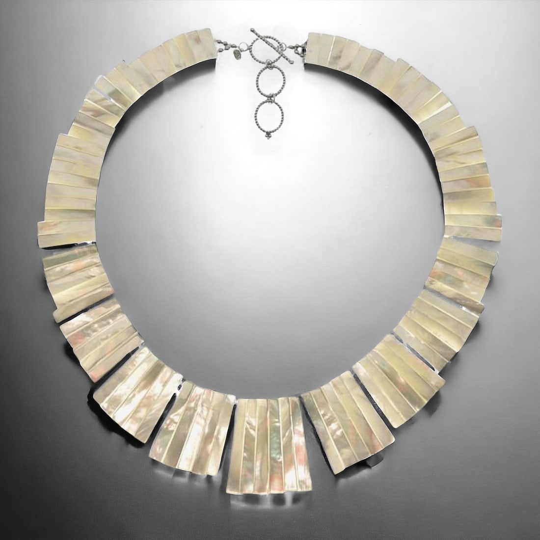 White Mother-of-Pearl Statement Necklace 19": Product Details Item: Necklace Metal: Sterling Silver Gemstone: White MOP Approximate Measurements: Width: 41.1 mm Ring Size: Not Applicable Chain Length: 19" Chain Metal: Sterling Si