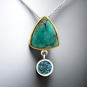 Southwest Perfection! Turquoise Pendant set in Two-Tone Sterling Silver and adorned with a round