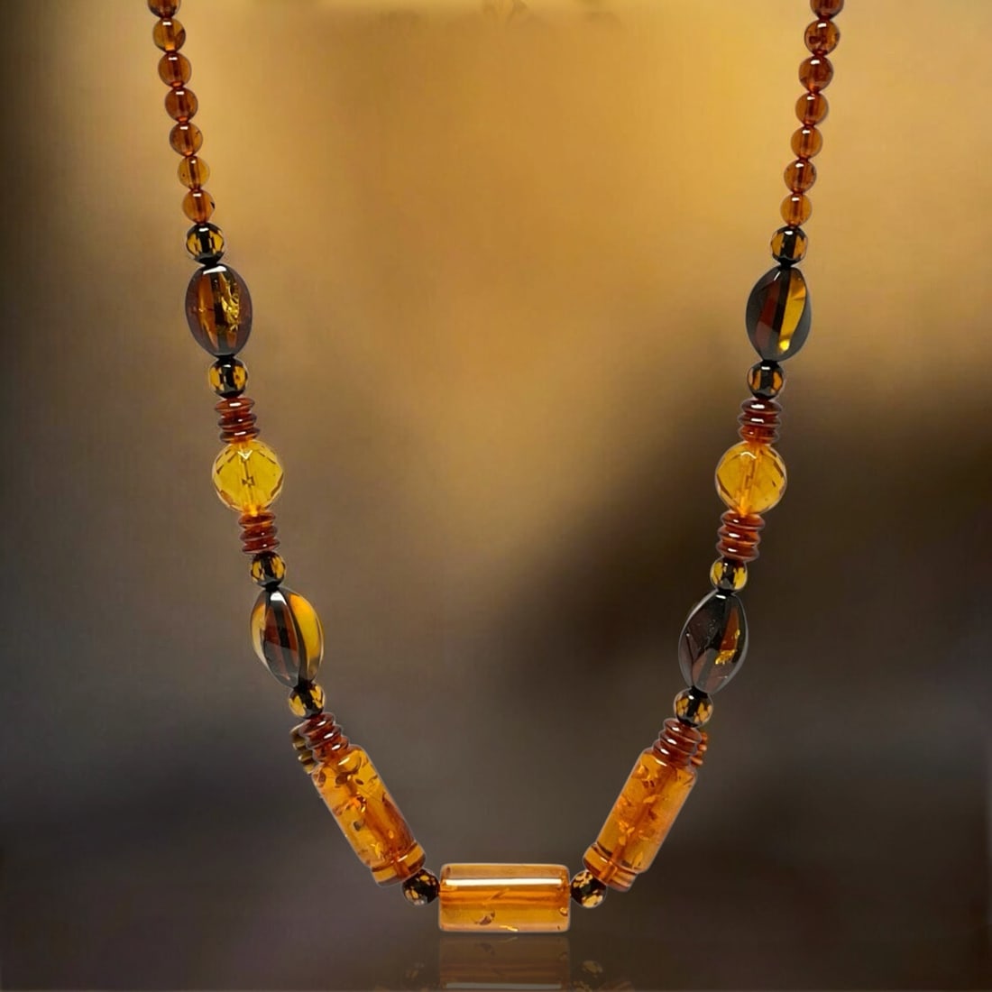 Radiant Golden Glow 18" Amber Necklace – Timeless Natural Elegance: Product Details Item: Necklace Metal: Not Applicable Gemstone: Amber Approximate Measurements: Width: 10.7mm Ring Size: Not Applicable Chain Length: 18" Chain Metal: Not Applicable <