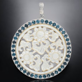 White Mother-of-Pearl Carved Pendant in Sterling Silver and Surrounded by London Blue Topaz