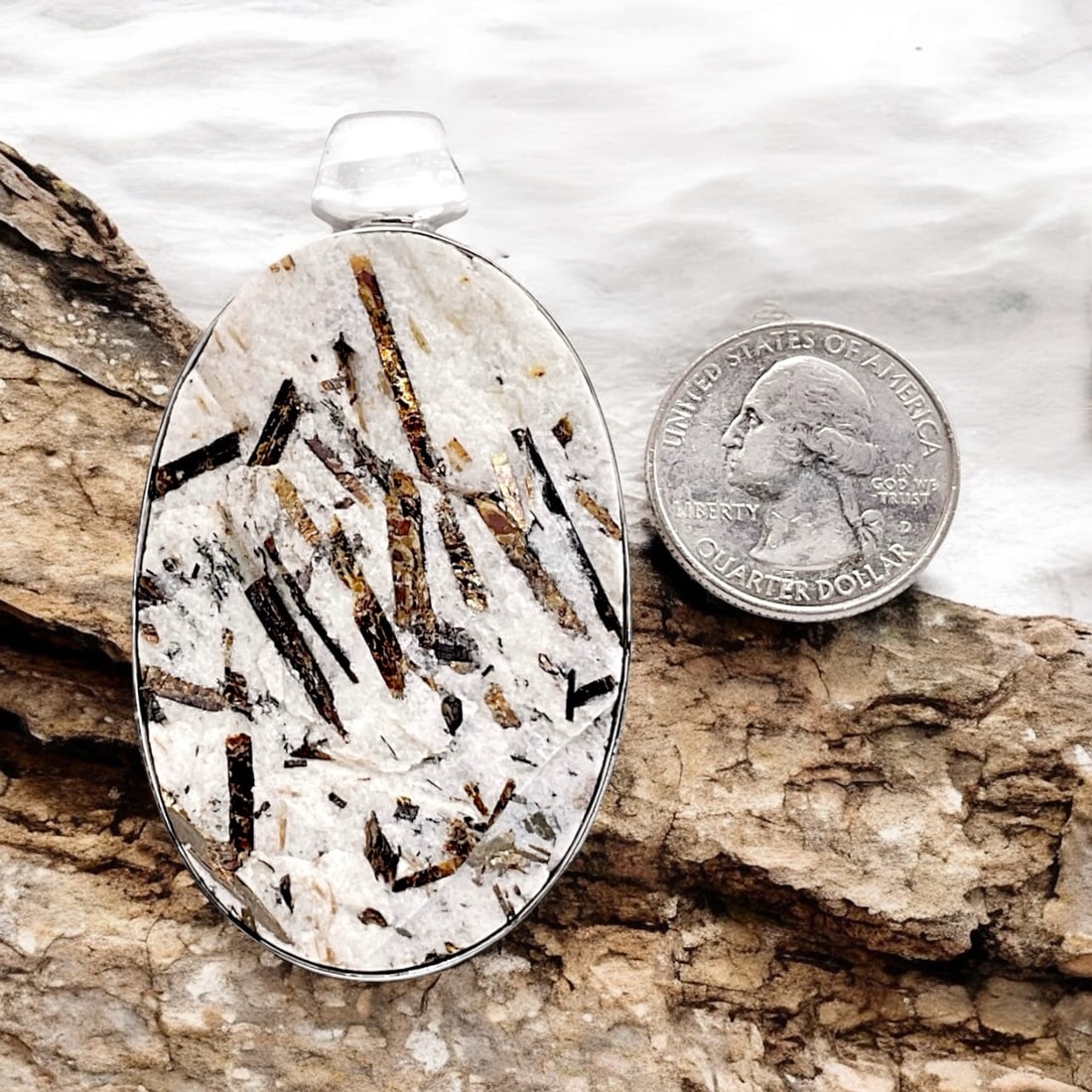 Oval Astrophyllite Drusy Gemstone Pendant, Set in Sterling Silver: Astrophyllite Drusy Stone size: 56 mm X 36 mm Product Details Item: Pendant Metal: Sterling Silver Gemstone: Oval Astrophyllite Drusy Approximate Measurements: Overall Pendant: 67.1 mm X 37.9 mm Ring