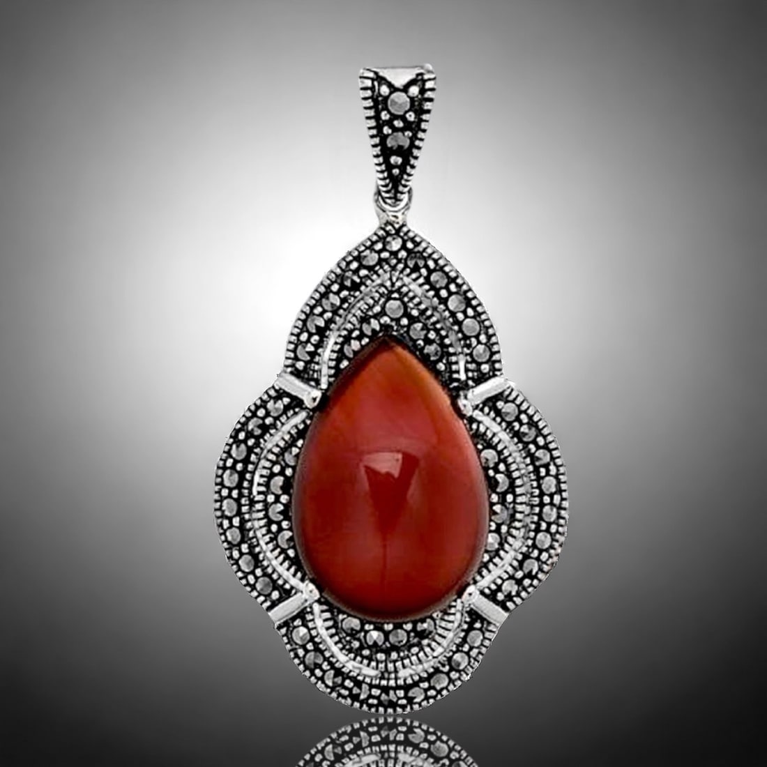 Deep Red Agate Pear Shaped Sterling Silver Pendant with Marcasite Accents: Product Details Item: Pendant Metal: Sterling Silver Gemstone: Red Agate & Marcasite Approximate Measurements: 41.5 mm X 22 mm Ring Size: Not Applicable Chain Length: Not Applicable Chai