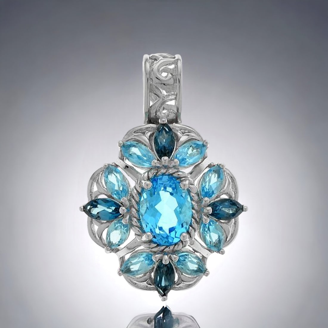 3.14 Cttw Sterling Silver Pendant with Swiss Blue Oval Topaz & Marquise London Blue Accents: Swiss Blue Topaz: One oval cut 8 mm X 6 mm and eight marquise cut 5 mm X 2.5 mm London Blue Topaz: Four marquise cut 5 mm X 2.5mm Product Details Item: Pendant Metal: Sterling Silver Gemstone: 3.14ctw