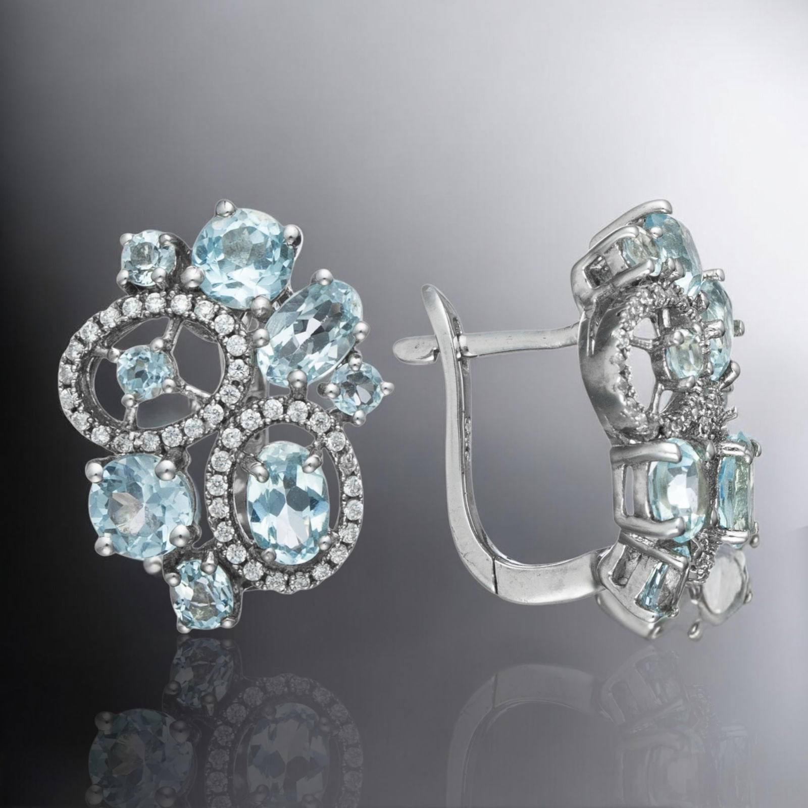 Spectacular Blue Topaz Sterling Silver Clip Earrings with White Topaz: Product Details Item: Earrings Metal: Sterling Silver Gemstone: Blue Topaz & White Topaz Approximate Measurements: 21.1 mm X 16.1 mm Ring Size: Not Applicable Chain Length: Not Applicable