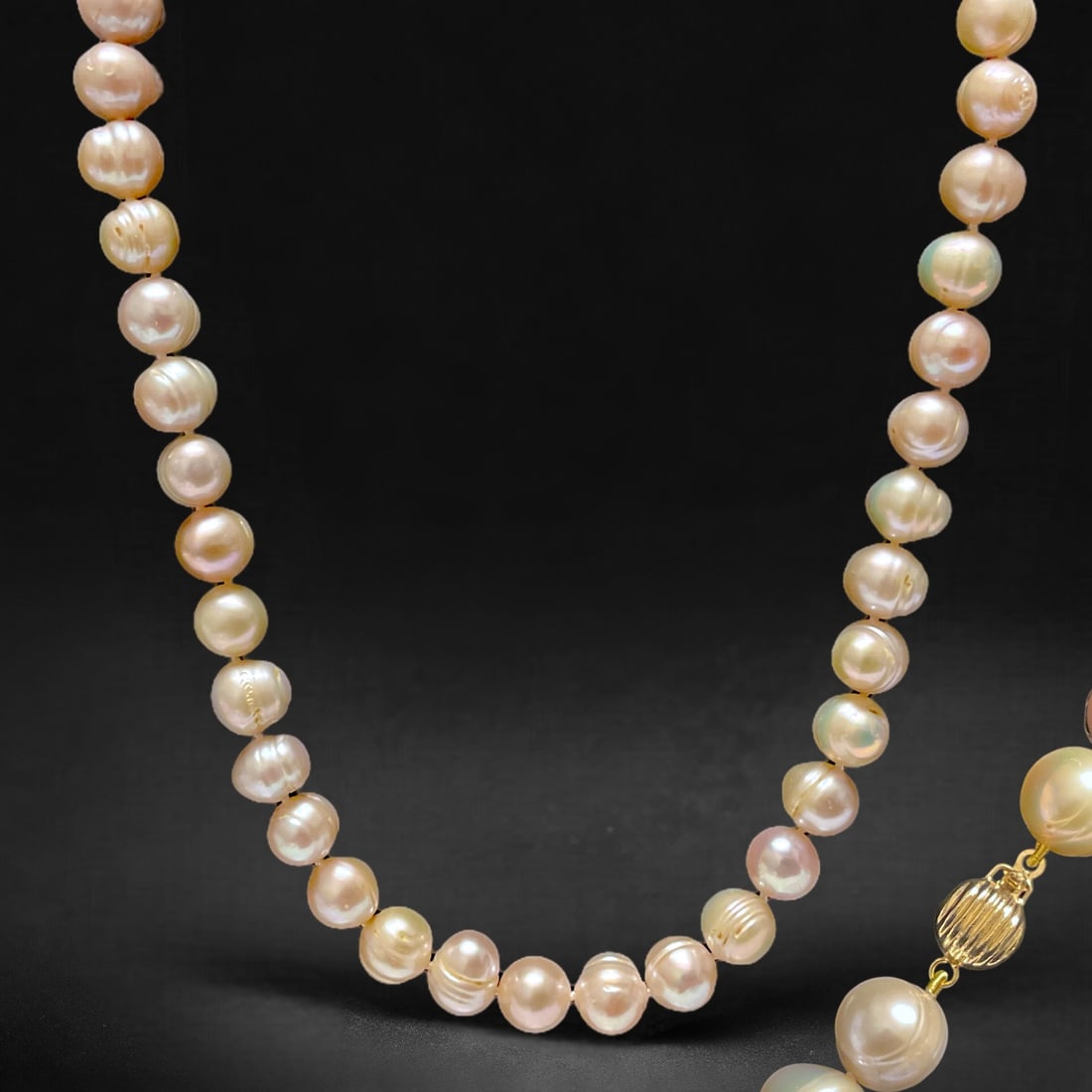 14K Gold Classic Pearl Necklace – 17": Product Details Item: Necklace Metal: 14K Gold Gemstone: Genuine Pearl Approximate Measurements: Width: 9-11mm Ring Size: Not Applicable Chain Length: 17" Chain Metal: Not Applicable