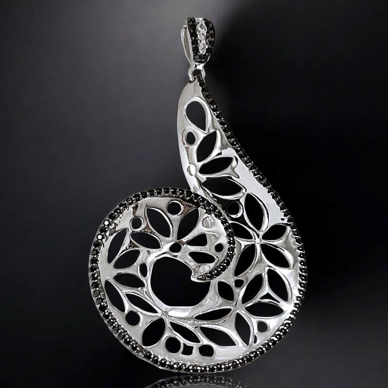 Majestic Black Spinel Sterling Silver Pendant: Product Details Item: Pendant Metal: Sterling Silver Gemstone: Black Spinel Approximate Measurements: 54.4 mm X 32.9 mm Ring Size: Not Applicable Chain Length: Not Applicable Chain Metal