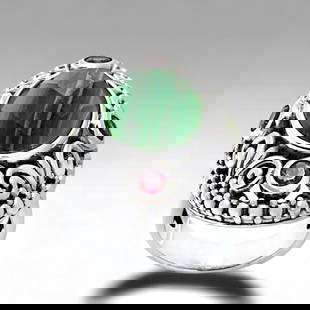 Malachite Sterling Silver Ring with Chrome Diopside & Rhodolite Garnet: Product Details Item: Ring Metal: Sterling Silver Gemstone: Malachite, Rhodolite Garnet, & Chrome Diopside Approximate Measurements: Width: 26.5 mm Ring Size: 5 Chain Length: Not Applicable<