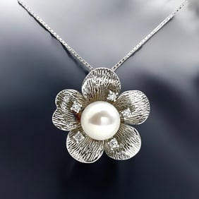 Enchanting Pearl Flower Pendant with sparkling Simulated Diamond accents on an 18" Sterling Silver
