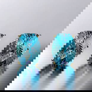 10K Yellow Gold Blue Topaz Stud Earrings: Product Details Item: Earrings Metal: 10K Gold Gemstone: Blue Topaz Approximate Measurements: 8 mm X 6 mm Ring Size: Not Applicable Chain Length: Not Applicable Chain Metal: Not Applicable 