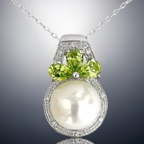 Timeless Pearl Pendant paired with White & Green CZ to create a enchanting design with 18" chain