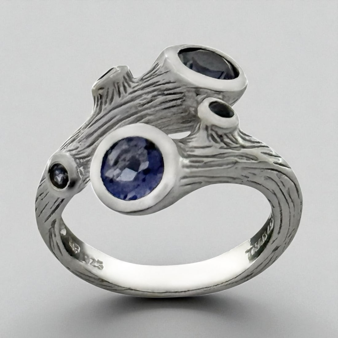 Sterling Silver Iolite Tree Bark Bypass Ring - Size 6: Product Details Item: Ring Metal: Sterling Silver Gemstone: Iolite Approximate Measurements: Width: 16.8 mm Ring Size: 6 Chain Length: Not Applicable Chain Metal: Not Applicable