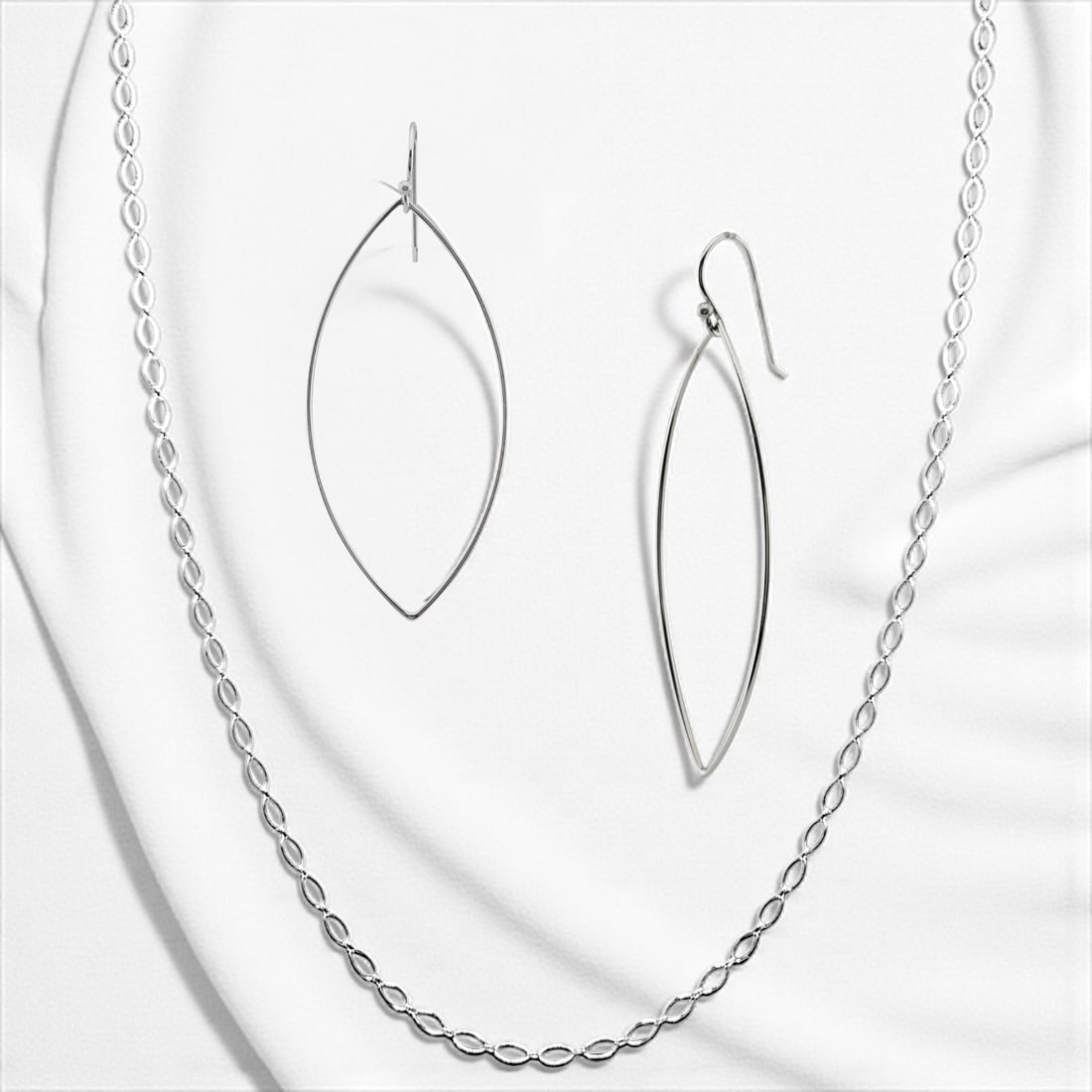 Elegant Marquise Shape Sterling Silver Chain Necklace&Earrings: Product Details Item: Necklace & Earrings Set Metal: Sterling Silver Gemstone: None Approximate Measurements: Earrings: 2 3/4" X 1 1/4" Chain: 28" + 2" extension Ring Size: Not Applicable Chain