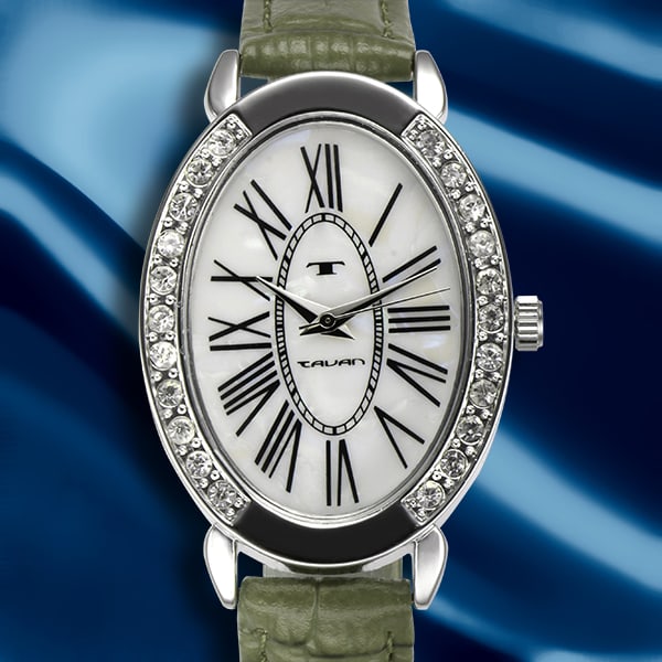 Tavan Ladies Watch – 38mm Oval Elegance: This refined Tavan Ladies Watch features a beautifully crafted 38mm x 39mm oval case that exudes timeless sophistication. The Mother-of-Pearl dial shimmers with elegance, accented by Roman numeral hou